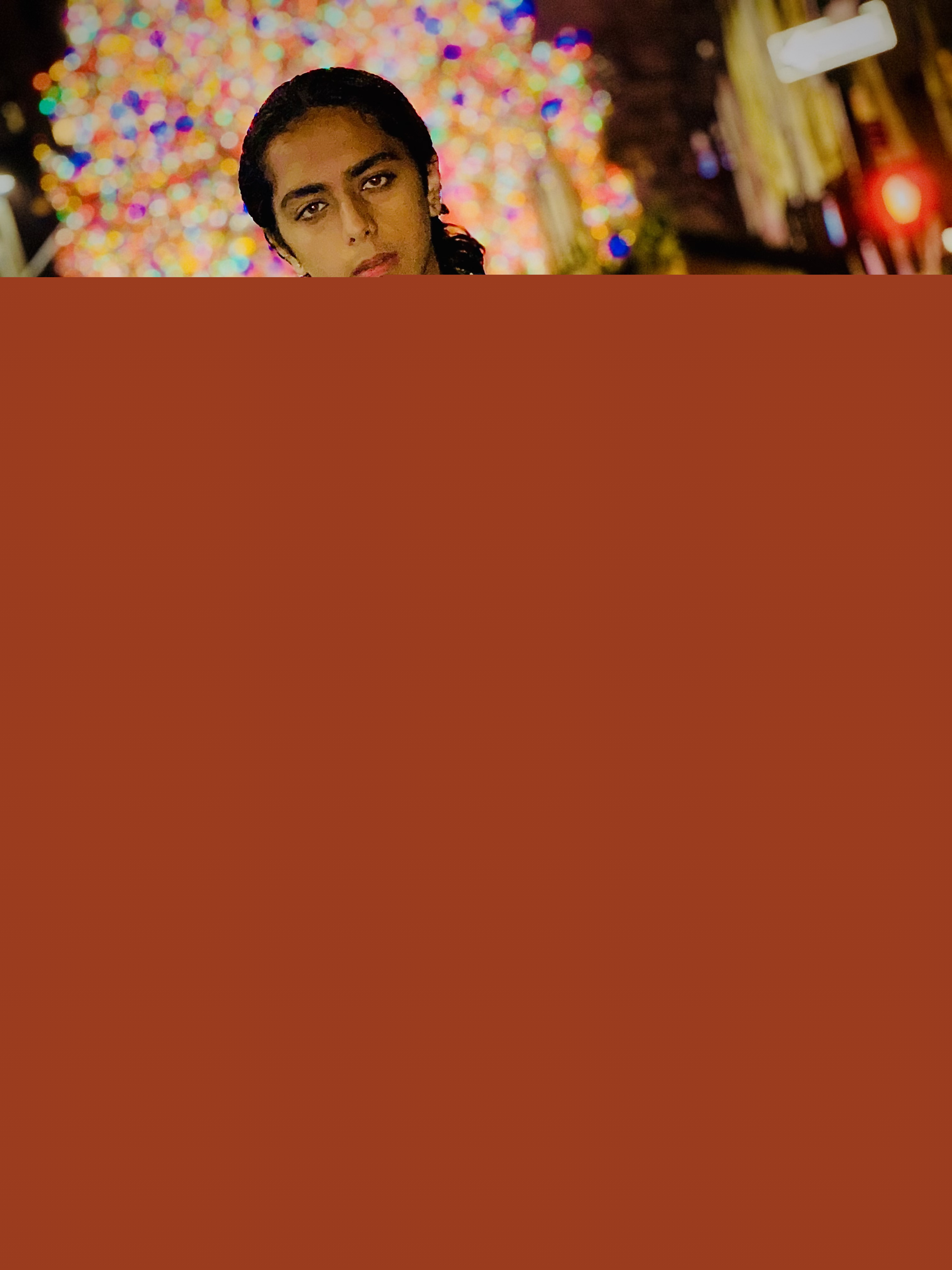 Aryan Rohira standing next to Rockefeller Center in Manhattan